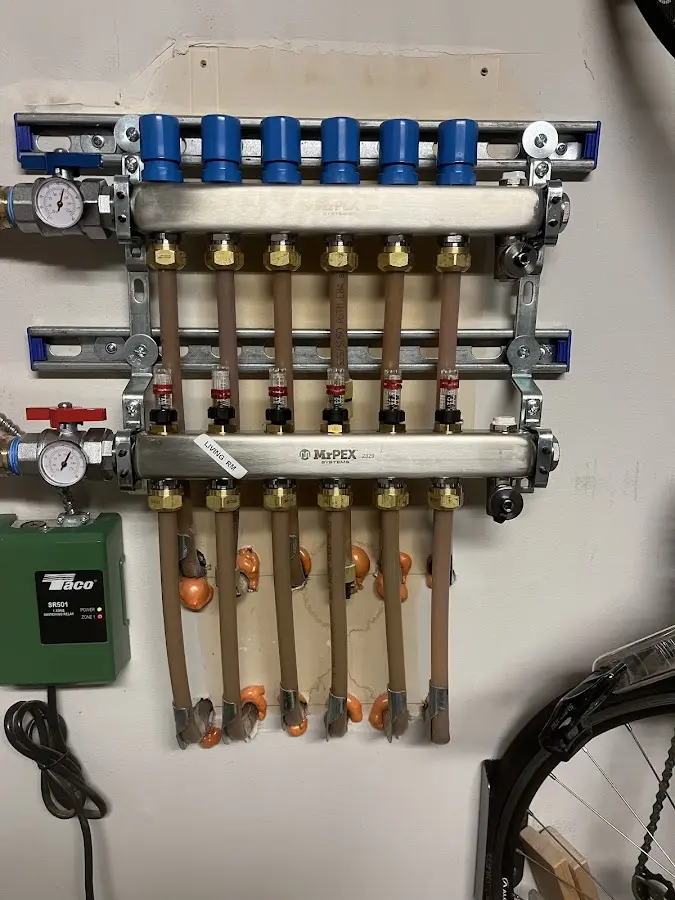 Plumber performing Water Heater Repair at a residential property in Combes